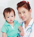 Baby And Female Doctor Stock Photo
