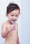 Baby And Toothbrush Stock Photo