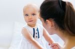 Baby Girl And Her Mother Playing At Home Stock Photo