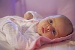 Baby Girl Rests In The Cradle Stock Photo