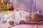 Baby Girl Rests In The Cradle Stock Photo