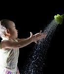 Baby Playing With Water Drop Stock Photo