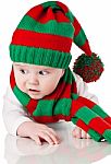 Baby With Christmas Hat And Scarf Stock Photo