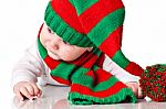 Baby With Christmas Hat And Scarf Stock Photo