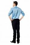 Back Pose Of A Casual Businessman Stock Photo