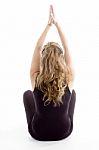 Back Pose Of Girl Doing Yoga Stock Photo