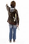 Back Pose Of Pointing Boy Holding Skateboard Stock Photo