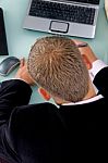 Back Pose Of Working Businessman Stock Photo