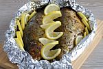 Baked Herring In Spices And Herbs In Foil Stock Photo