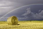 Bale Of Hay And Rainbow Stock Photo