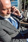 Bearded Businessman With Working Outside The Office Stock Photo