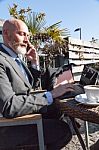 Bearded Businessman With Working Outside The Office Stock Photo