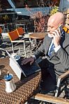 Bearded Businessman With Working Outside The Office Stock Photo