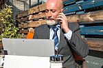 Bearded Businessman With Working Outside The Office Stock Photo