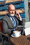 Bearded Businessman With Working Outside The Office Stock Photo