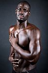 Beautiful And Muscular Man In Dark Background Stock Photo