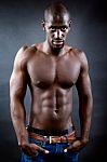 Beautiful And Muscular Man In Dark Background Stock Photo