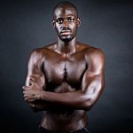 Beautiful And Muscular Man In Dark Background Stock Photo