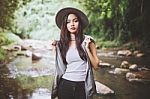 Beautiful Asian Woman Smiling Around The Nature Green And Water Stock Photo