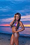 Beautiful Black African American Woman Posing On The Beach At Sunset Stock Photo