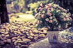 Beautiful Bouquet Of Artificial Flowers In A Ceramic Vase On Park Stock Photo