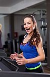 Beautiful Brunette On A Treadmill Stock Photo