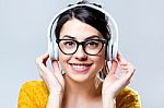 Beautiful Brunette Woman Listening To Music Stock Photo