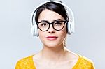 Beautiful Brunette Woman Listening To Music Stock Photo