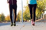 Beautiful Couple Running In The Street Stock Photo