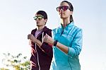 Beautiful Couple Running In The Street Stock Photo