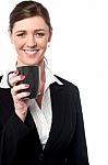 Beautiful Female Manager Enjoying Hot Coffee Stock Photo