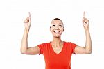 Beautiful Female Pointing Upwards Stock Photo