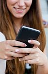 Beautiful Girl Having Fun With Smartphone After Class Stock Photo