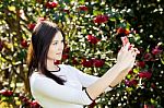 Beautiful Girl Posing For A Selfie With Her Smart Phone Stock Photo