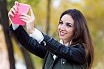 Beautiful Girl Taking A Selfie In Autumn Stock Photo