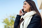 Beautiful Girl Using Her Mobile Phone In City Stock Photo