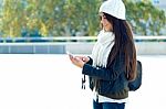 Beautiful Girl Using Her Mobile Phone In City Stock Photo