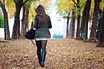 Beautiful Girl Walking In Autumn Stock Photo