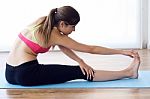 Beautiful Healthy Young Woman Doing Exercise At Home Stock Photo