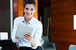 Beautiful Modern Businesswoman Holding Tablet Computer Stock Photo