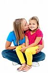 Beautiful Mom Kissing Her Pretty Daughter Stock Photo