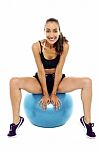 Beautiful Smiling Fit Lady Relaxing On Big Swiss Ball Stock Photo