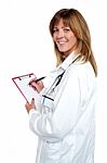 Beautiful Smiling Physician Writing Prescription Stock Photo