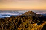 Beautiful Sun Rise On Top Mountain With Could And Camping Area Stock Photo