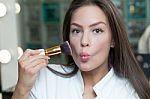 Beautiful Woman Applying Makeup Stock Photo