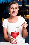 Beautiful Woman Enjoying Tempting Dessert Stock Photo