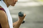 Beautiful Woman Holding Weights Stock Photo