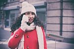 Beautiful Woman In Red Coat And Wool Cap And Gloves With Smartph Stock Photo