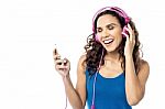 Beautiful Woman Listening Music On Her Cell Phone Stock Photo