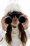 Beautiful Woman Looking Through Binocular Stock Photo